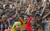 Agitated garment workers protest against factory closure in Gazipur