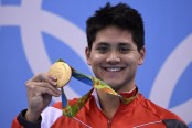 Schooling stuns Phelps for Singapore's first Games gold