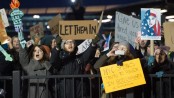 Large Kennedy Airport protest against Trump refugee detentions ends in jubilation as judge halts deportations
