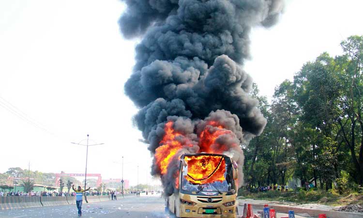 RMG workers block Uttara road, bus torched
