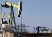 Oil prices wobble on lower US supplies