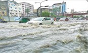 Heavy rain lashes Dhaka, cripples normal life
