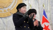 Daughter of North Korean leader Kim shares spotlight with nuclear missiles